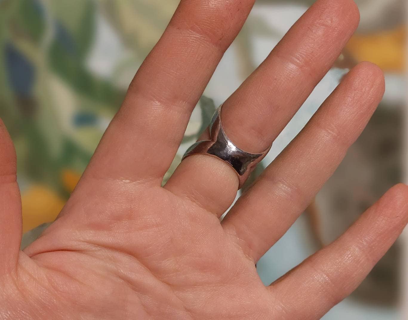 Close-up of an adjustable arthritis finger splint ring available in sterling silver or bronze