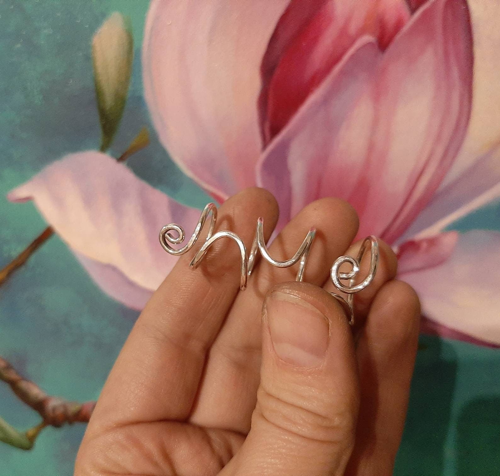 Close-up of a sterling silver 925 finger splint ring designed to support both finger joints