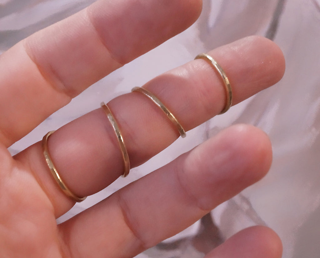 Close-up of an adjustable brass finger splint ring with handcrafted finish