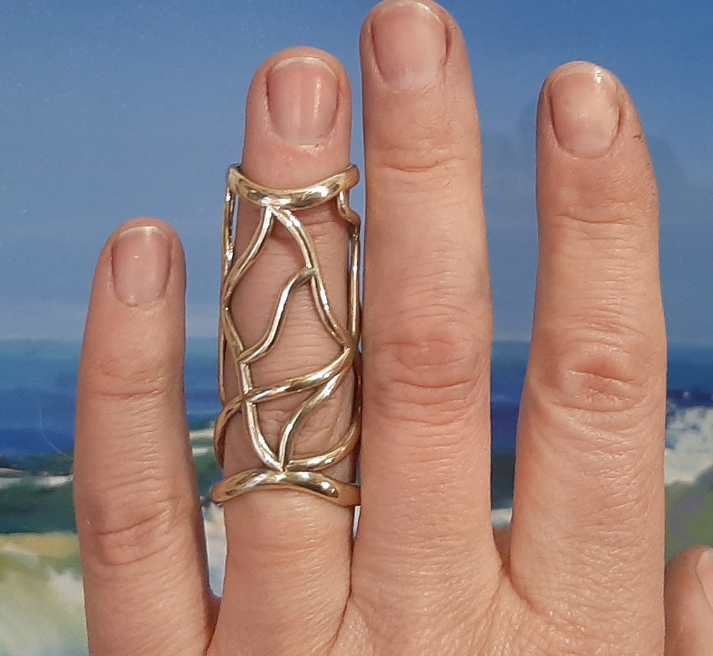 Bronze full finger splint ring designed to support both finger joints and improve alignment