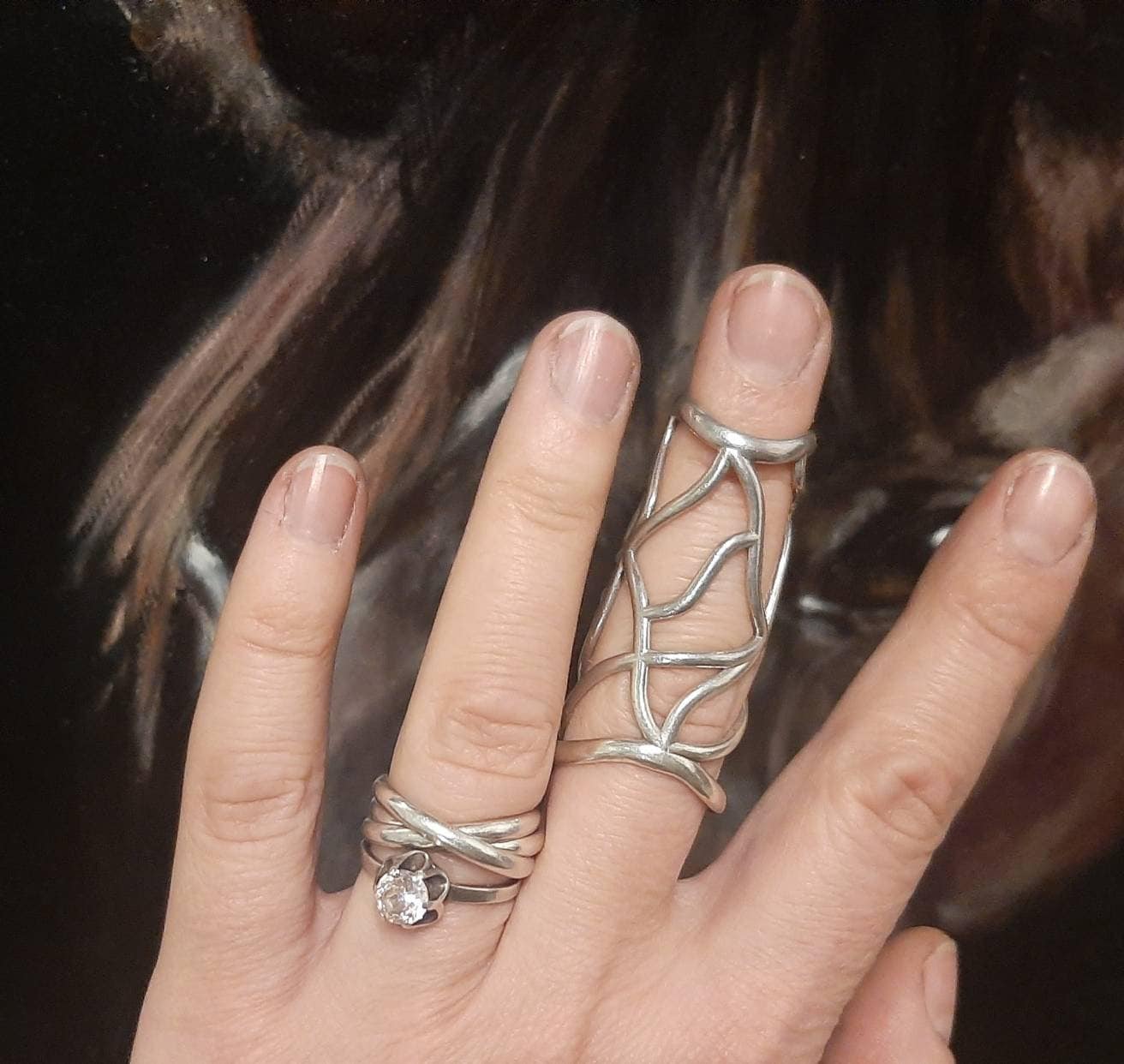 Sterling silver finger support ring designed to stabilize both upper and middle finger joints