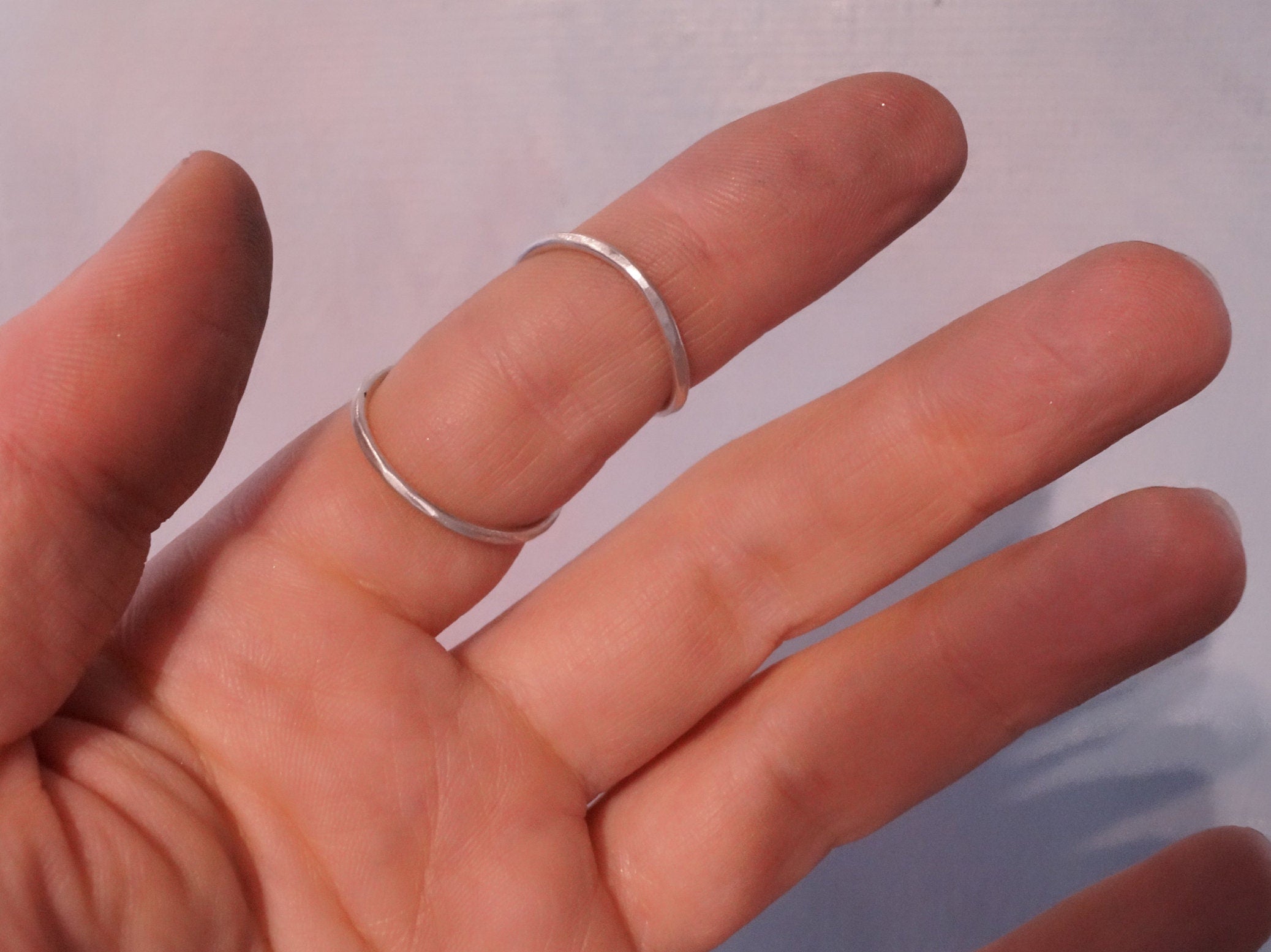 Elegant silver  finger splint helping stabilize DIP joint.