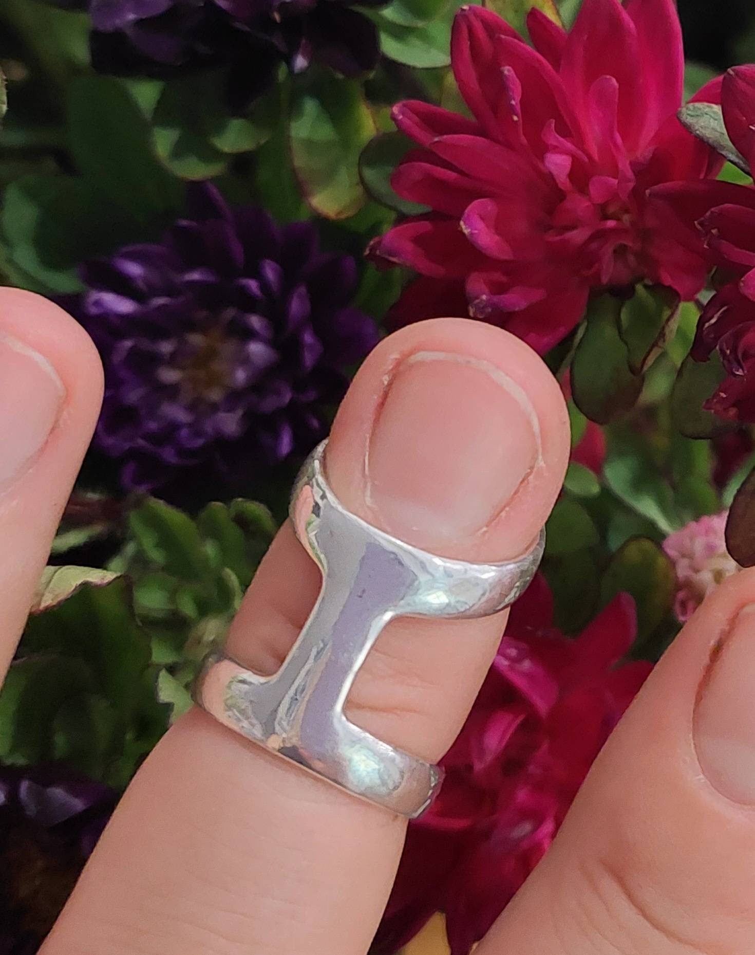Artisan-crafted bronze ring splint combining finger support with jewelry-inspired design.