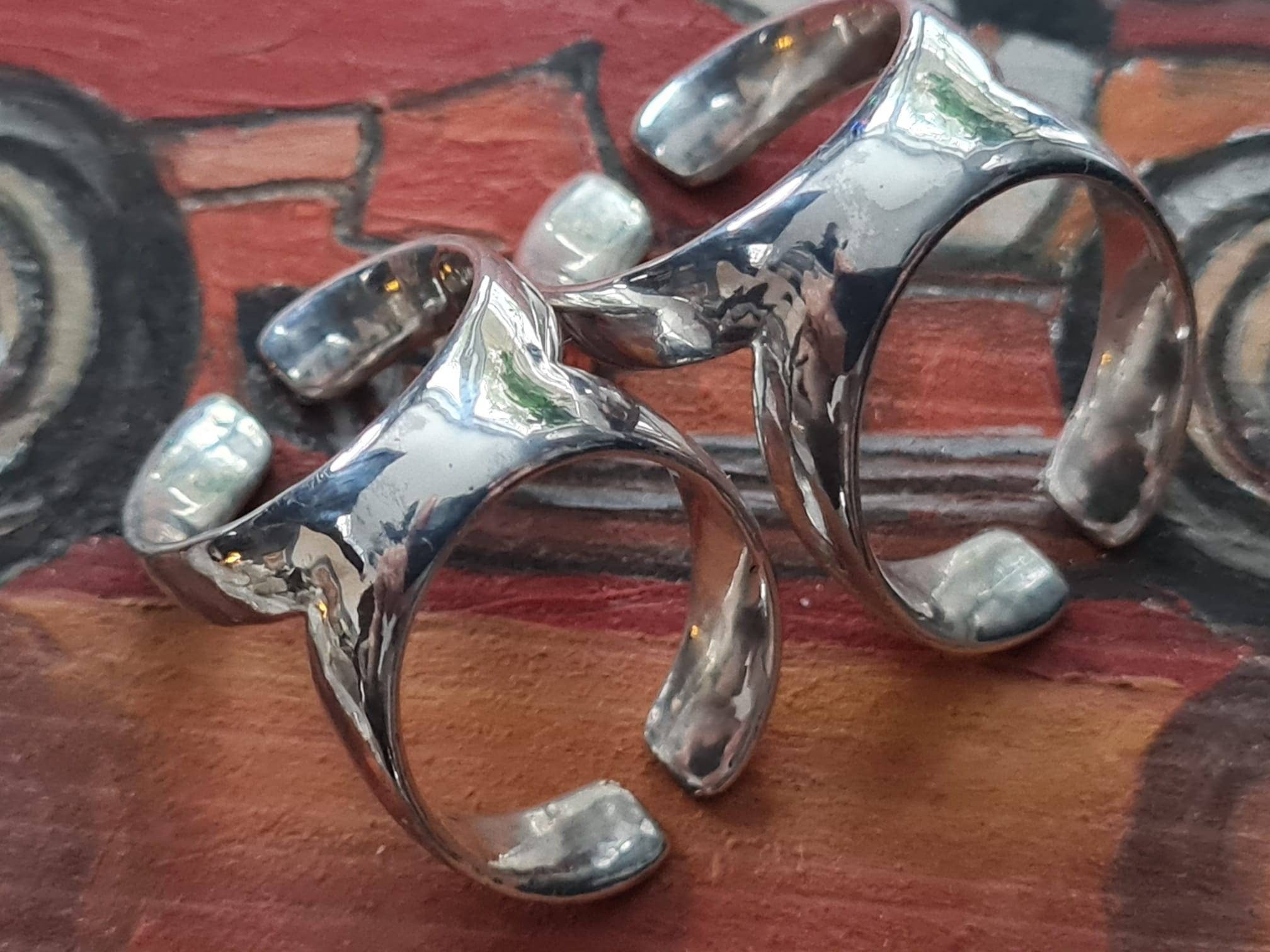 Sterling silver or bronze finger splint ring designed to support finger conditions