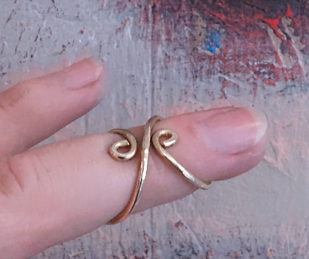 Side view of a hammered textured finger splint ring crafted in brass or sterling silver