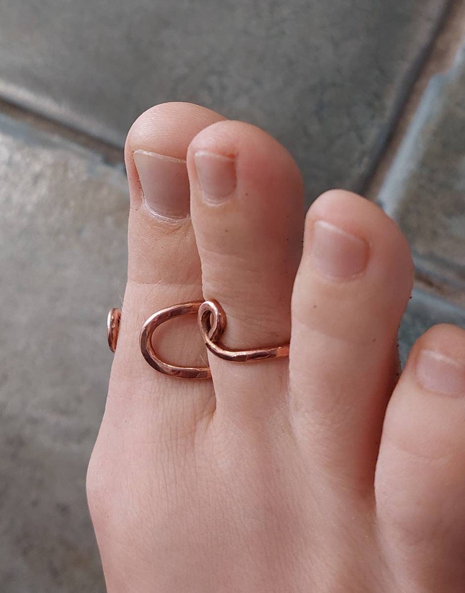 Handcrafted copper toe splint with two rings for toe joint support