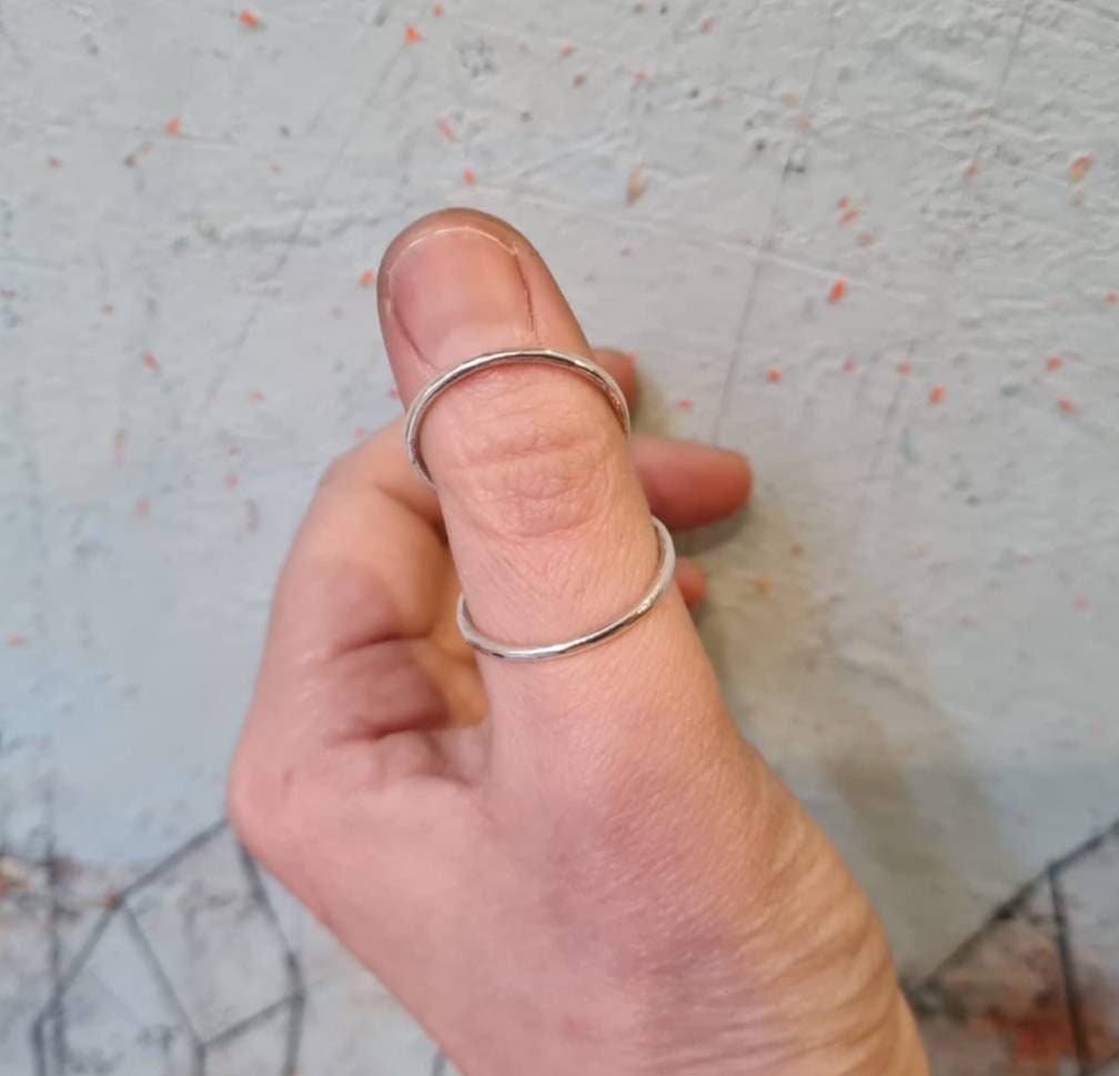 Handcrafted hammered thumb splint ring available in sterling silver, brass, or copper