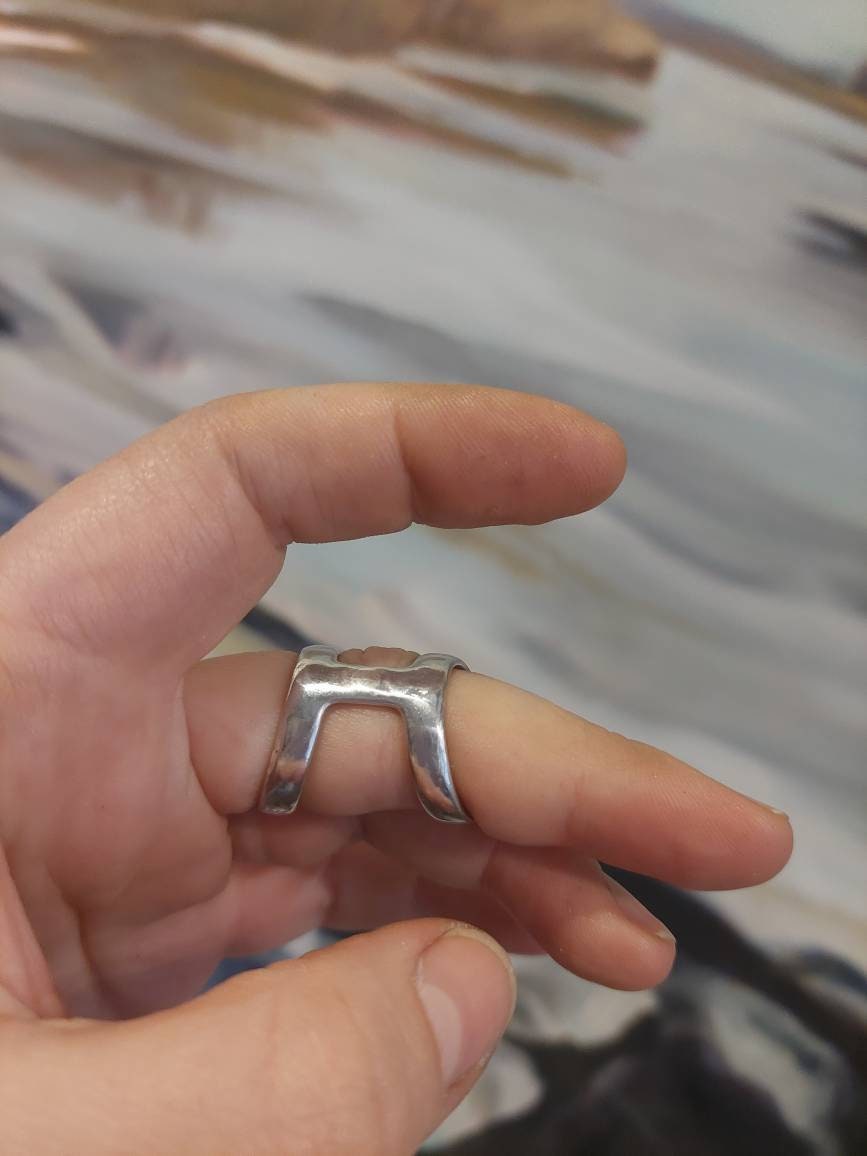 Elegant bronze  finger splint helping stabilize  joint