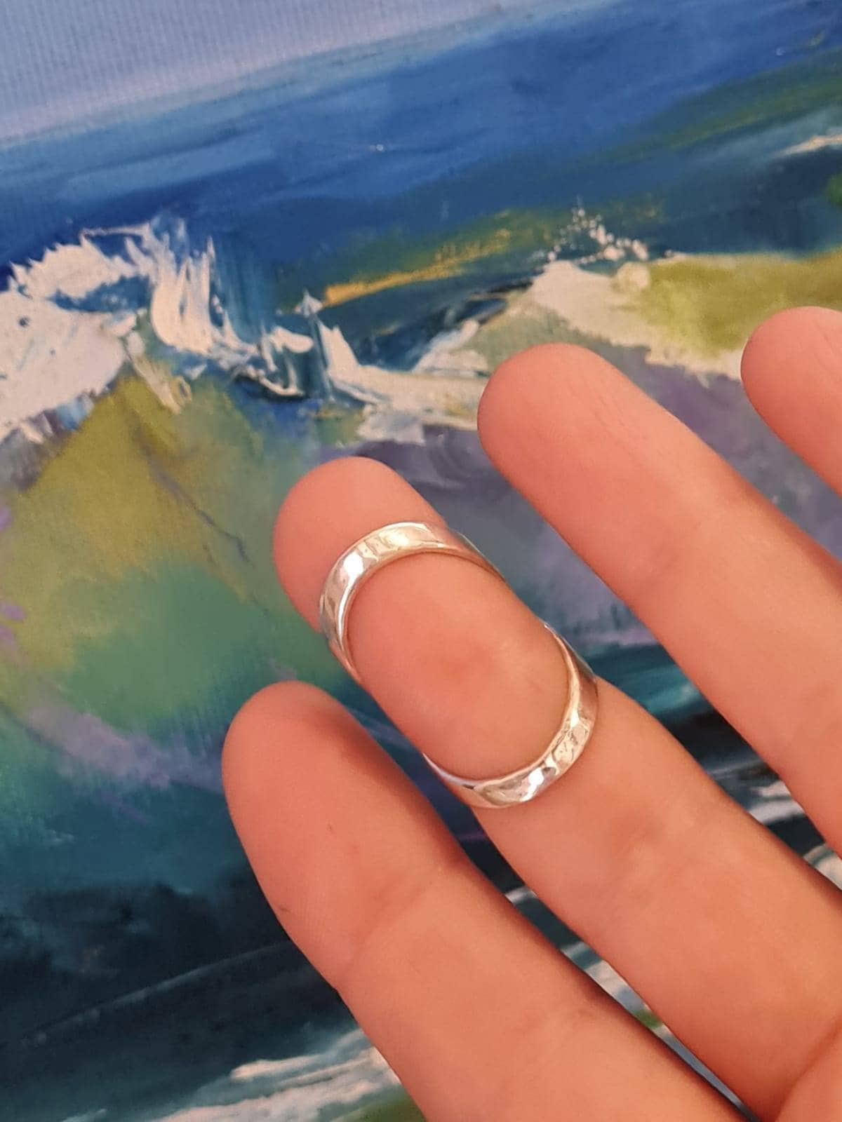 Close-up of a handmade  finger splint ring with smooth polished finish