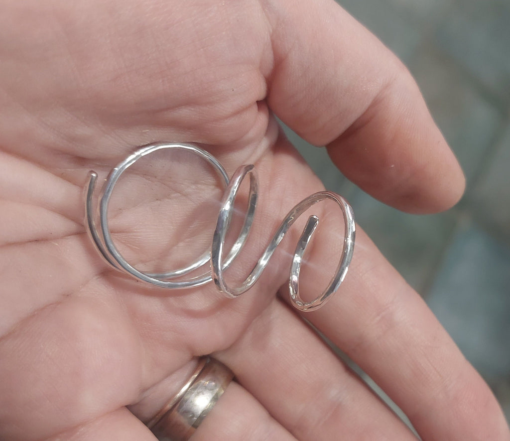 Close-up of a solid sterling silver 925 thumb MCP splint ring with polished finish