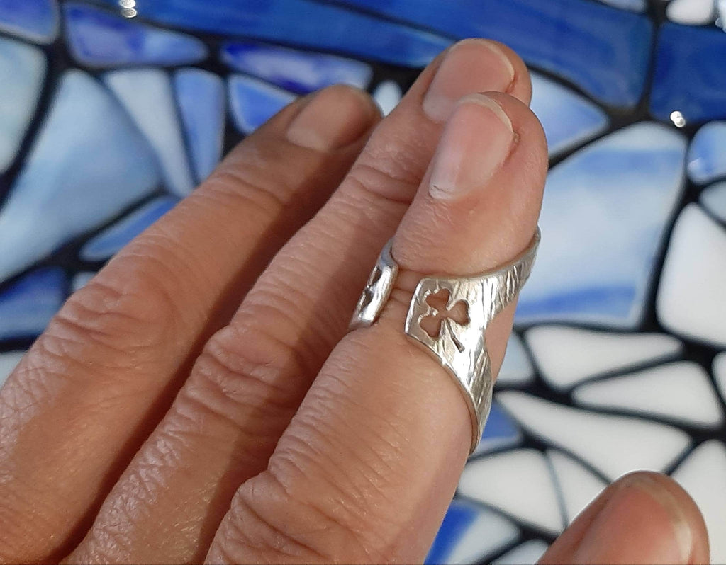 Side view of an adjustable finger splint ring designed for  finger support and joint stability