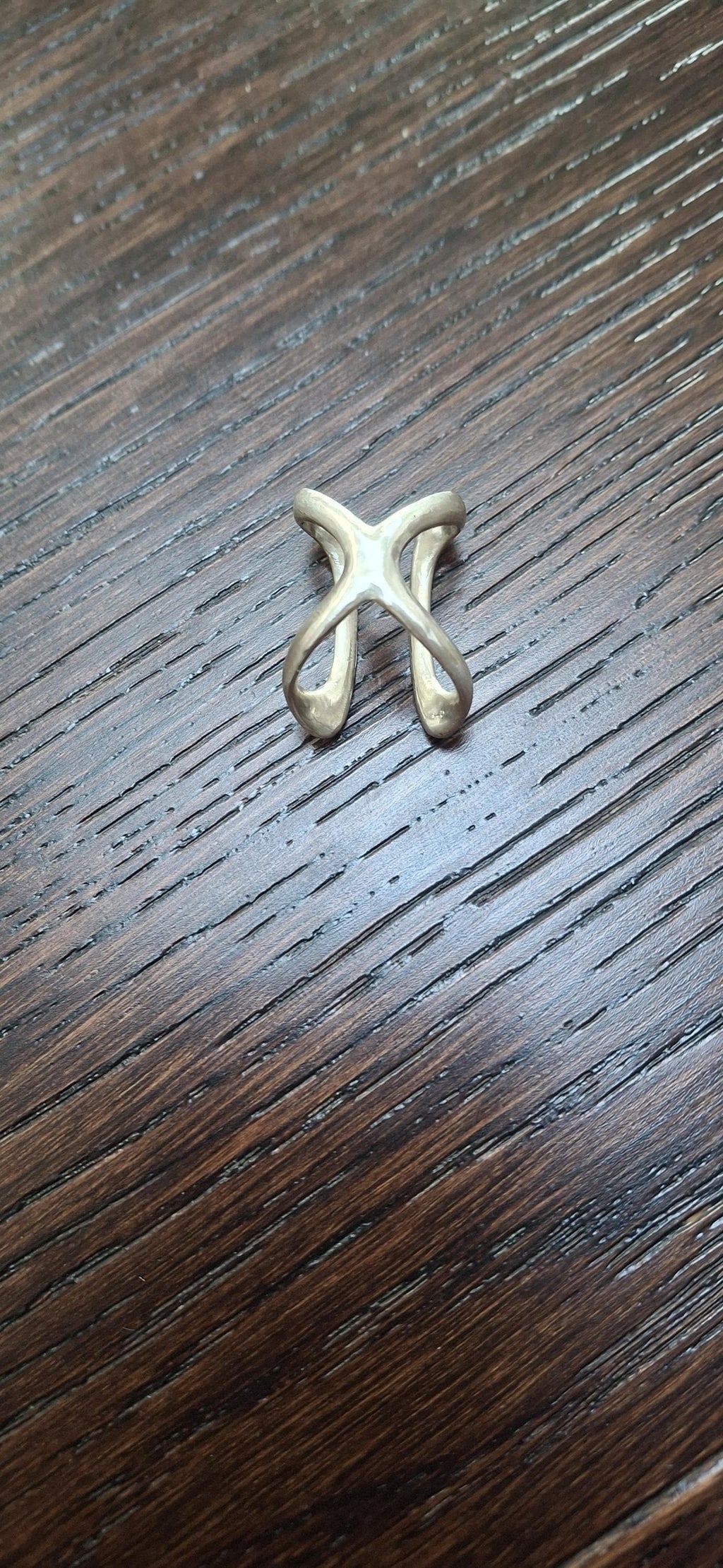 Close-up of an adjustable toe splint ring with handcrafted details and polished finish
