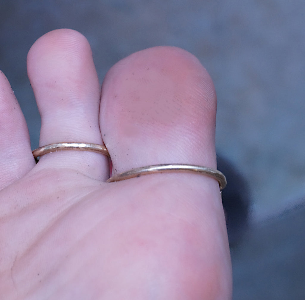 Close-up of an adjustable two ring toe splint with handcrafted details